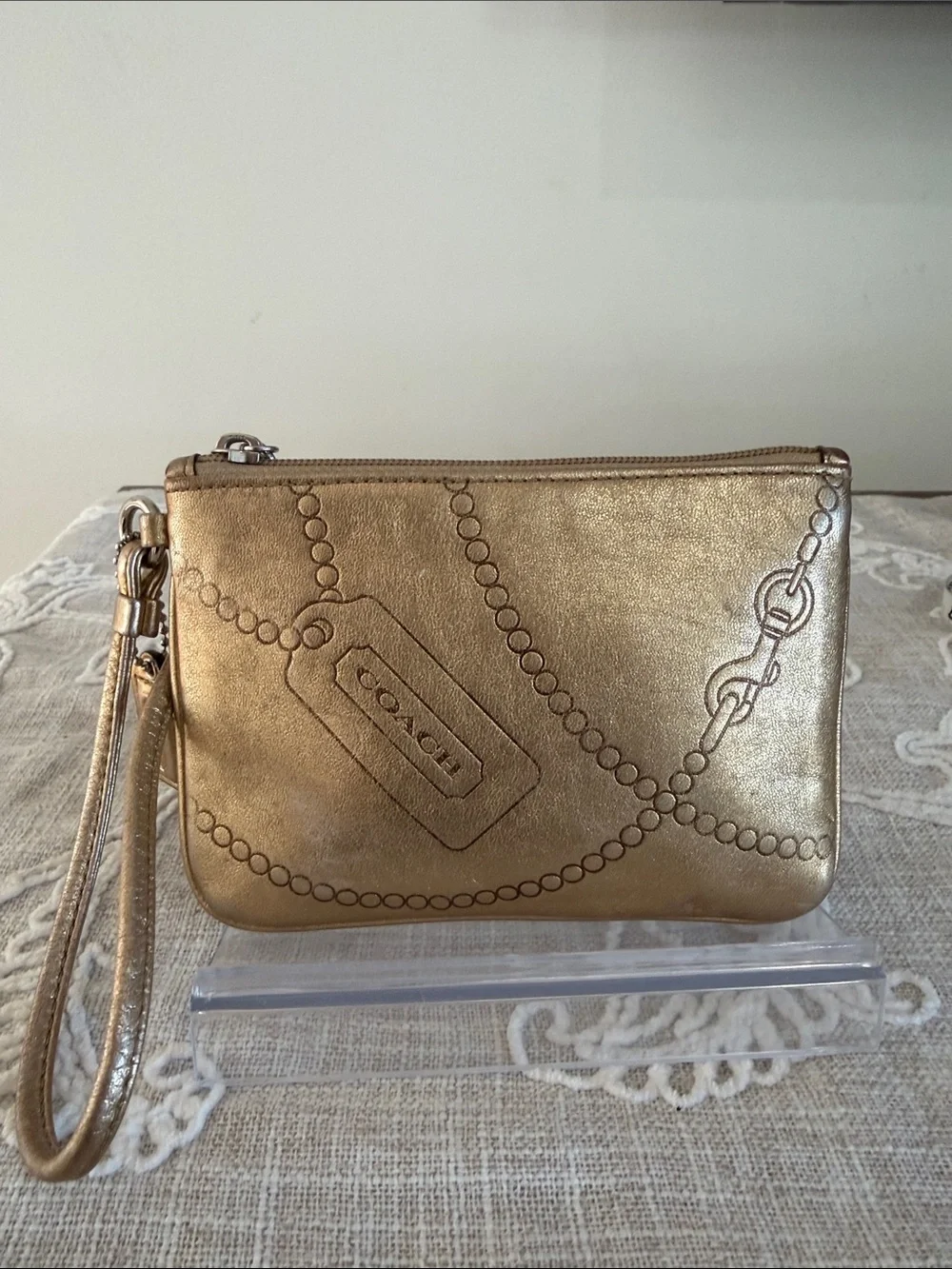 Coach Metallic Gold Wristlet with Embossed Chain Motif